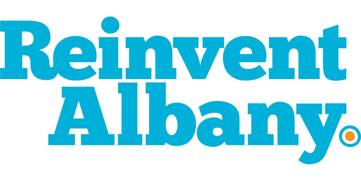 A white background and blue text that reads "Reinvent Albany," with an orange dot to the right, outlined with a blue circle.